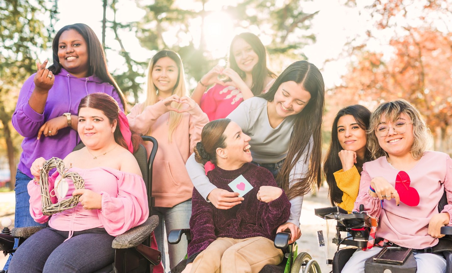 A multi-generational family gathered together, including a wheelchair user